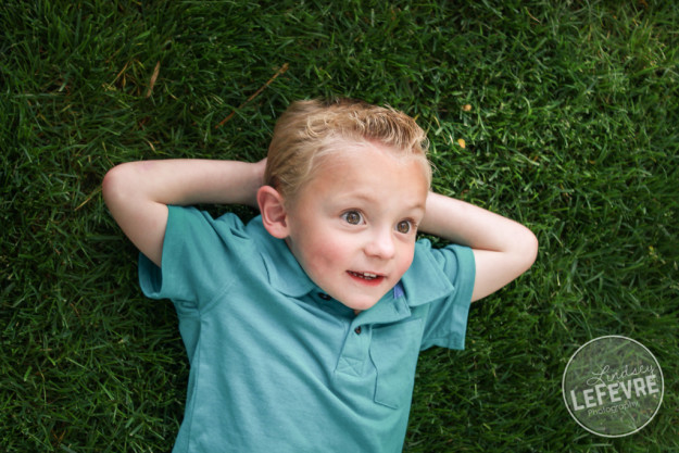 Lindsey LeFevre Photography. Family sitting on the grass at the ricks gardens. 